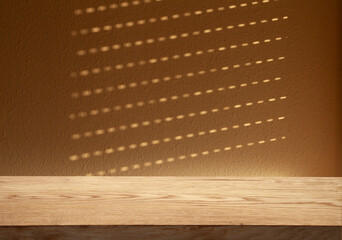 blurred background of a window with a table on a dark wall with reflections of warm light rays