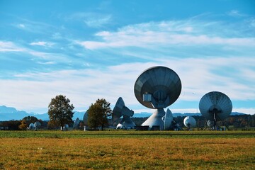 panorama with huge satellite dishes in the foreground and a part of the alps in the background, Raising, Bavaria