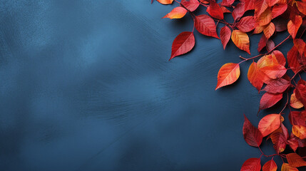 autumn background with colored red leaves on blue slab