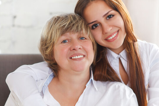 Portrait of a mature grandmother and teen granddaughter and teen granddaughter