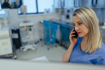 Portrait of ER doctor in hospital phone calling. Remote consultations with patient, telemedicine....