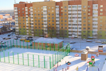 View of the playground and sports grounds in the city in winter