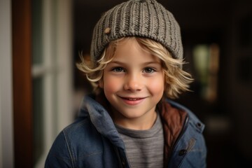 Portrait of a cute little boy in a knitted cap.
