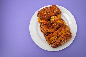 typical portuguese fruit cake Bolo rainha on white plate