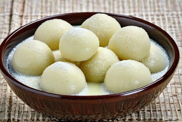 Fototapeta na wymiar Authentic Indian Sweet - Rasgulla, the Famous Bengali Sweet, Tempting the Taste Buds by ai generated