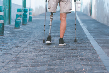 a full member of society an elderly man with a titanium prosthetic left leg walks smoothly in a...