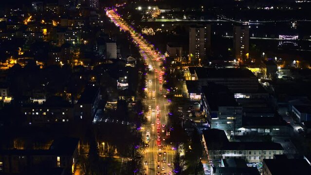 Aerial hyperlapse timelapse drone view of Chisinau city with moving traffic at night. Moldova