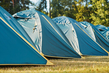 The vacant tents capture the essence of a memorable summer getaway, where laughter and stories once...