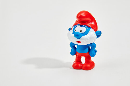 Cute figurine of Papa Smurf in white studio