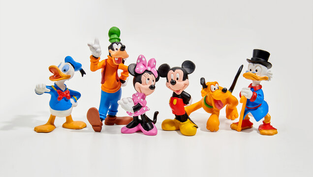 Figurines of Walt Disney cartoon characters in white studio