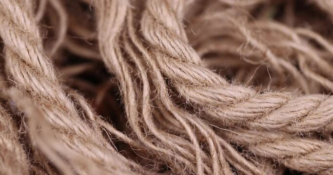 rough linen rope close-up, rough rope on a wooden table