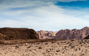 Fototapeta na wymiar mountains in the desert against the blue sky and white clouds in Egypt Dahab South Sinai