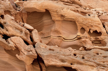texture of orange stone rock in a colored canyon close up