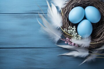 Banner. Easter eggs, feathers in a nest on a blue wooden background. The minimal concept. Top view. Card with a copy of the place for the text - Powered by Adobe