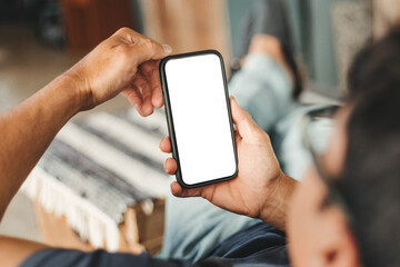 cell phone blank white screen mockup.hand holding texting using mobile on desk at office.background empty space for advertise.work people contact marketing business,technology
