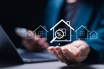 Real estate investment concept, Businessman use laptop with house icon for analyzing mortgage loan home and insurance real property mortgage. interest rate, Investment planning, business real estate.