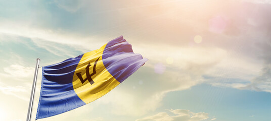 Barbados national flag cloth fabric waving on the sky - Image - Powered by Adobe
