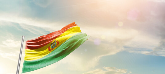Bolivia national flag cloth fabric waving on the sky - Image