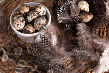Rustic Easter, quail eggs in a ceramic bowl on the table. The Bright Easter Holiday