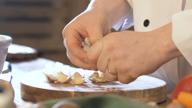 Hands Unwrap A Garlic Slow Motion 4k