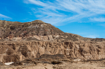 Fototapeta premium high rocky mountains in the desert against the blue sky and white clouds in Egypt Dahab South Sinai