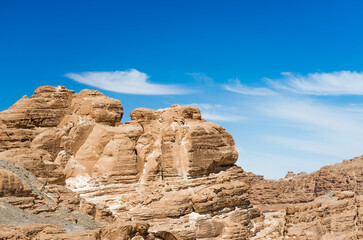 Fototapeta premium high rocky mountains in the desert against the blue sky and white clouds in Egypt Dahab South Sinai