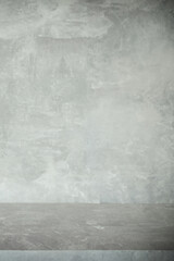 wooden table and grey wall background