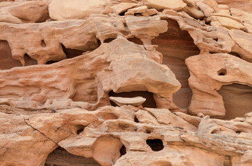 texture of orange stone rock in a colored canyon close up