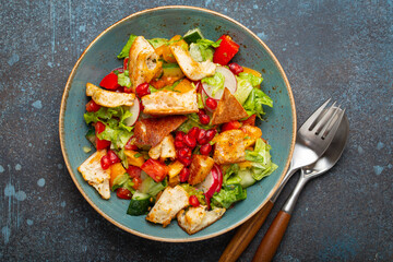 Traditional Levant dish Fattoush salad, Arab cuisine, made with pita bread croutons, vegetables and...