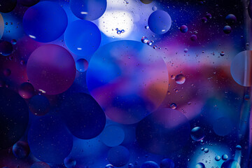 Photo of oil on a water surface with bubbles. Abstract colorful background. Macro close-up, not illustration