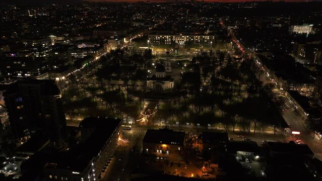 Aerial drone view of Chisinau center city with Cathedral and Government building at night. Moldova