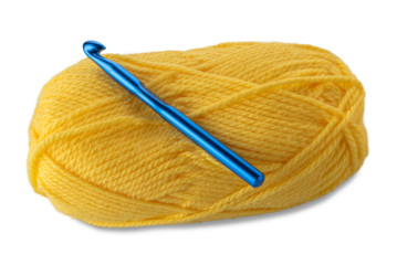 Ball of yellow-colored wool yarn with knitting weaving crochet hook 10 mm blue color isolated