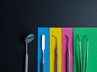 Dental instruments on a colorful background