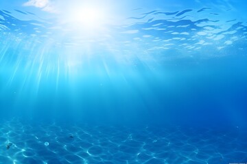 Fototapeta na wymiar Underwater view of blue sea with sunbeams and lens flare