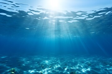 Underwater view of blue sea with sunbeams and lens flare