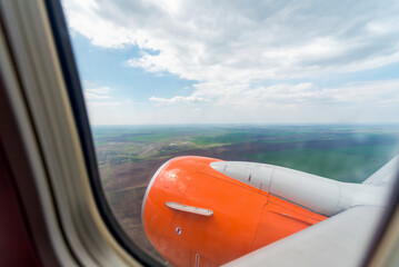 view from the airplane window of the airport during takeoff