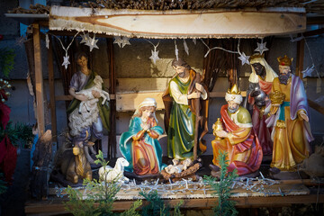 A model of the Traditional Nativity scene with a holy family in Bethlehem and the baby Jesus lying...