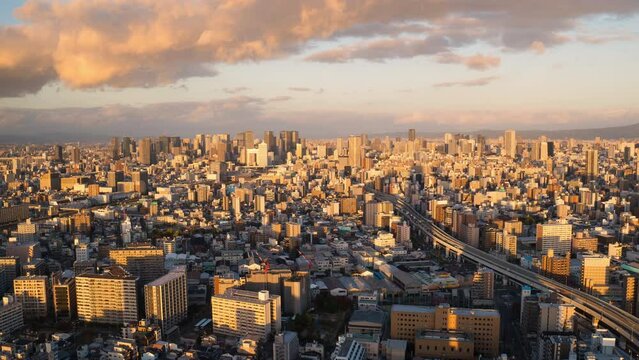 osaka city skyline timelapse day to night aerial view,pan time lapse of urban cityscape at sunset