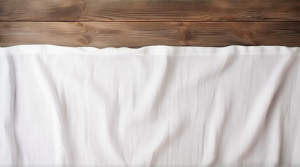 texture of empty white tablecloth on wooden background