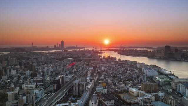 osaka city bay timelapse day to night aerial view,sun sets over the sea 