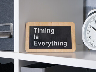 Timing is everything. Sign with motivational quote.