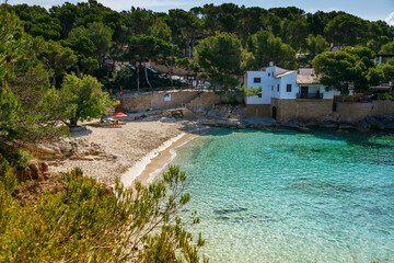 Fototapeta premium Cala Gat beach in Mallorca, displaying the serene Mediterranean waters
