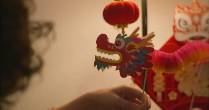 Girl Playing With Chinese Dragon Toy