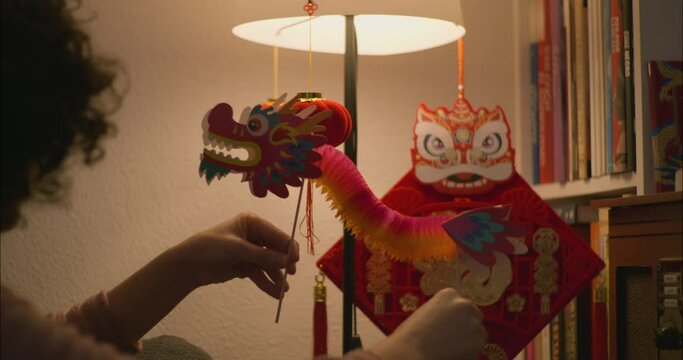 Girl Playing With Chinese Dragon Toy