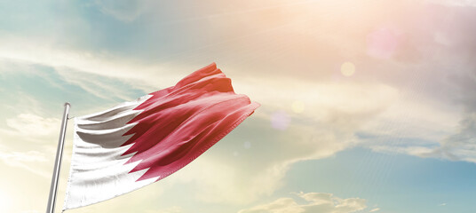 Qatar national flag cloth fabric waving on the sky - Image
