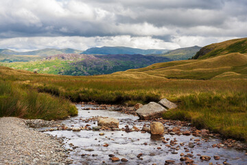 Stream and mountains: Little Gatesgarthdale and Hause Gill looking towards Borrowdale and Helvellyn: Lake District, Cumbria, UK