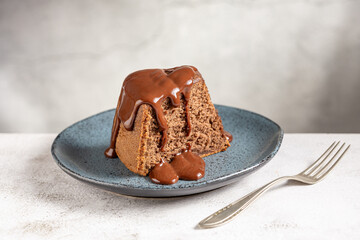 Slice of chocolate cake with chocolate sauce.