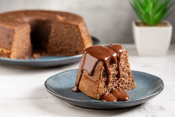 Slice of chocolate cake with chocolate sauce.