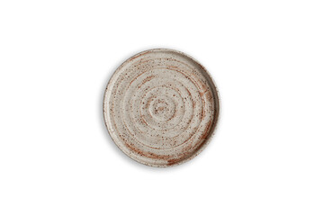 Handmade empty ceramic plate top view with copy space isolated on white background. Minimalism. Eco friendly ceramics handcraft tableware.