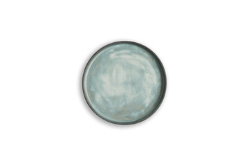 Handmade empty ceramic plate top view with copy space isolated on white background. Minimalism. Eco friendly ceramics handcraft tableware.